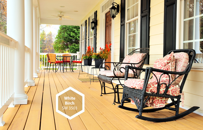 Wicker chairs are soft and weather resistant for comfortable evening chats.